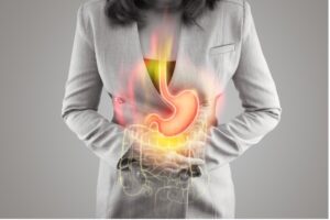 A woman is experiencing abdominal pain and GERD