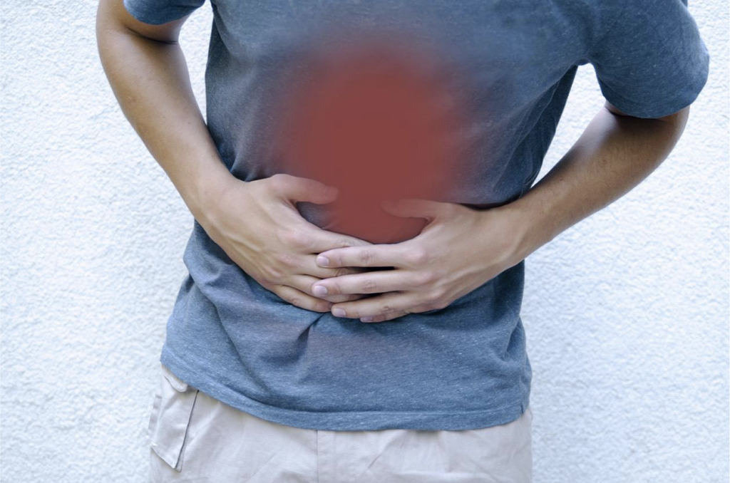 man-with-stomach-pain-holding-his-belly-gastrointestinal-disorders-concept